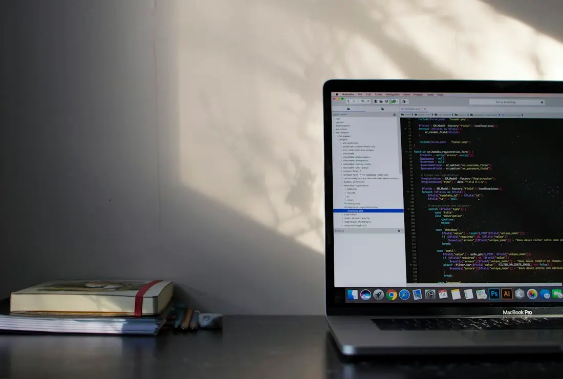 A laptop open on a codebase