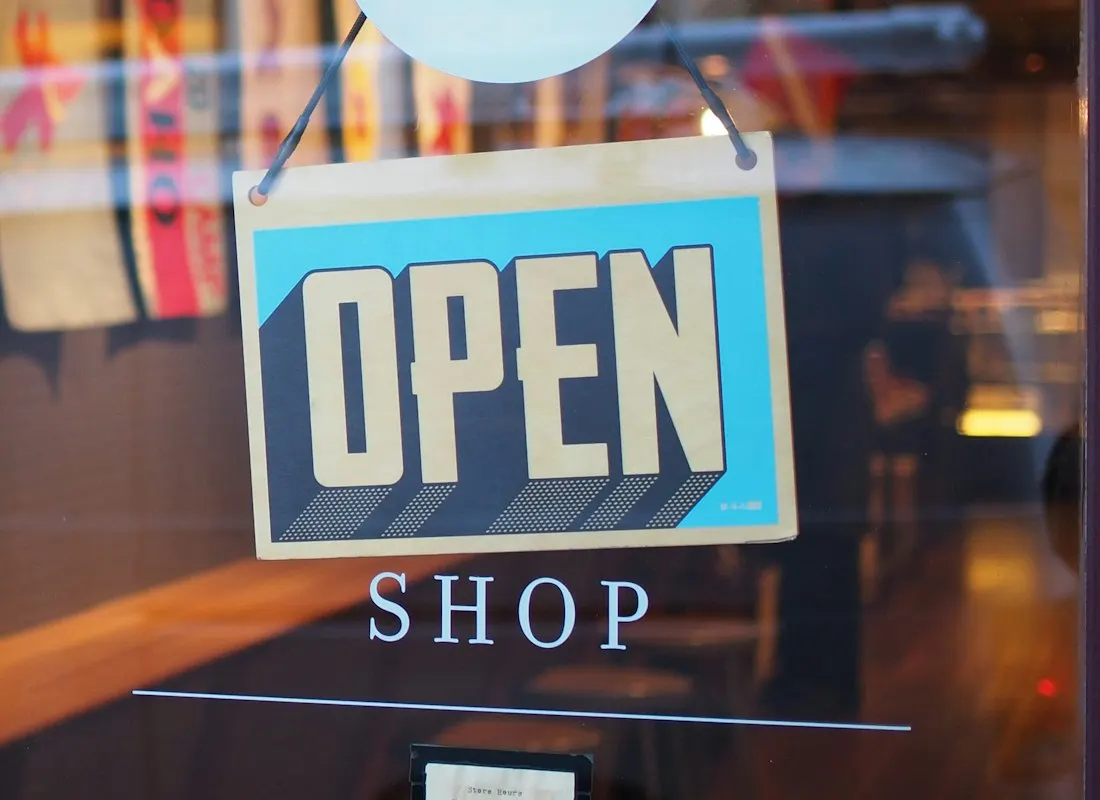 An open shop sign representing a retail business ready to serve customers